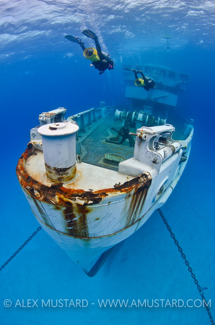 Divers expore wreck. USS Kittiwake, Cayman Islands.