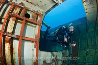 Diver inside USS Kittiwake wreck. Cayman Islands.