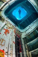 Diver in forward holds of USS Kittiwake. Cayman Islands.