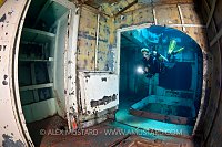 DIver in forward holds of USS Kittiwake. Cayman Islands.