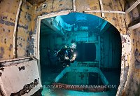 Diver in forward holds of USS Kittiwake. Cayman Islands.