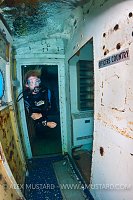 Diver inside USS Kittiwake wreck. Cayman Islands.