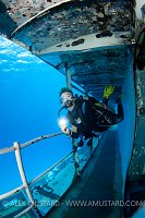 Diver explores USS Kittiwake wreck. Cayman Islands
