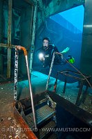 Diver In Engine Room. Kittiwake. Cayman Islands