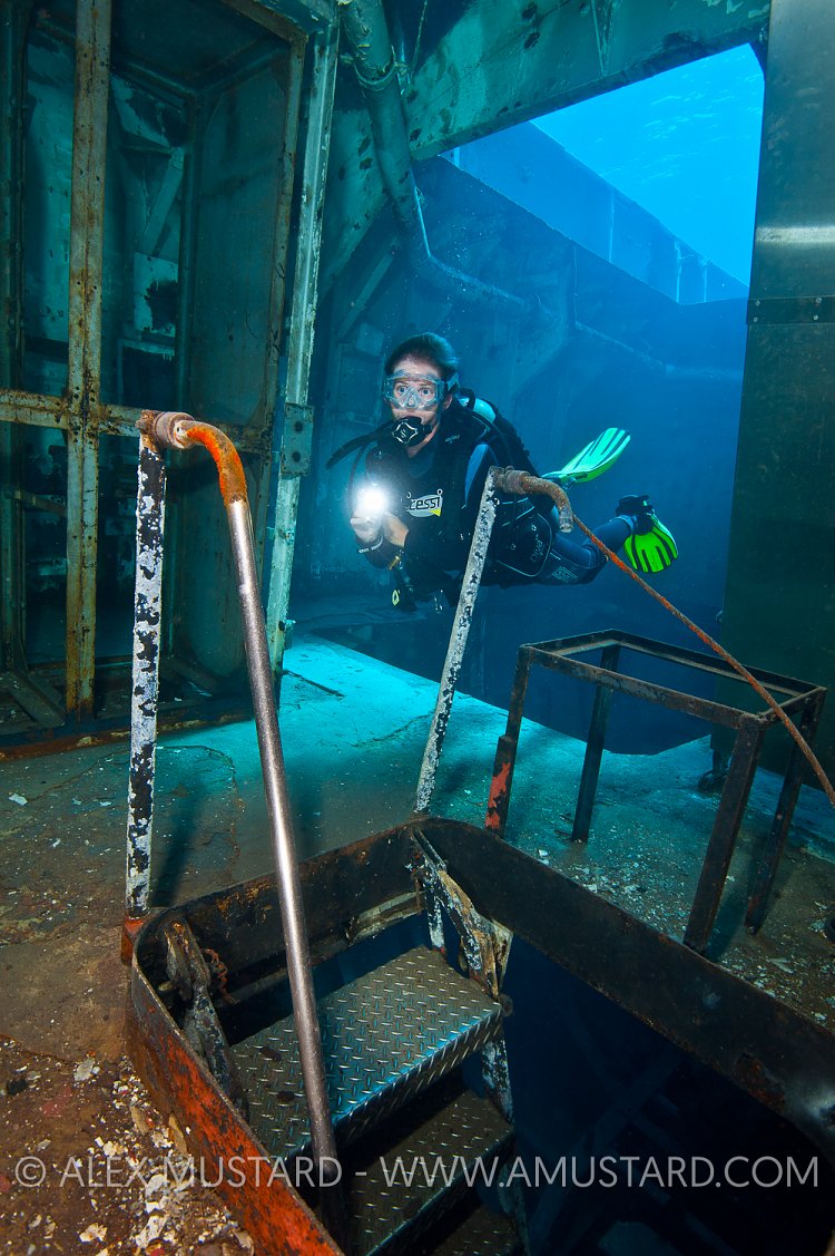 Diver In Engine Room. Kittiwake. Cayman Islands