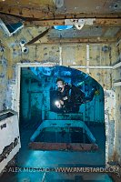 DIver in forward holds of USS Kittiwake. Cayman Islands.
