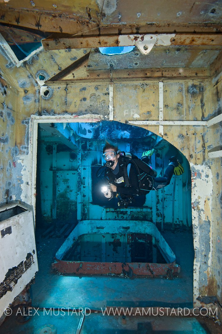 DIver in forward holds of USS Kittiwake. Cayman Islands.