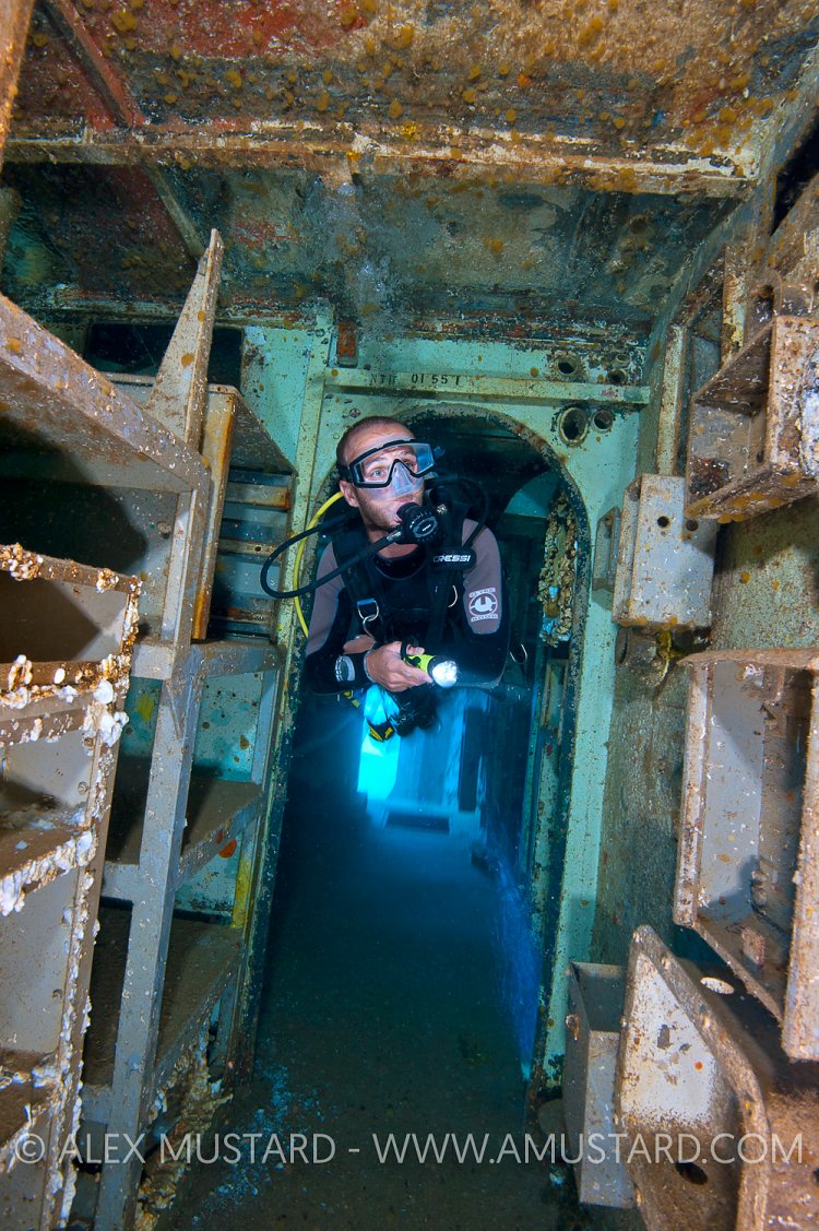 Diver Explores Kittiwake. Cayman Islands.