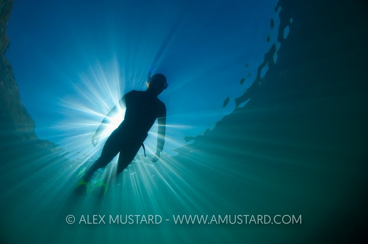 Snorkeller and Sun. Dorset. UK.