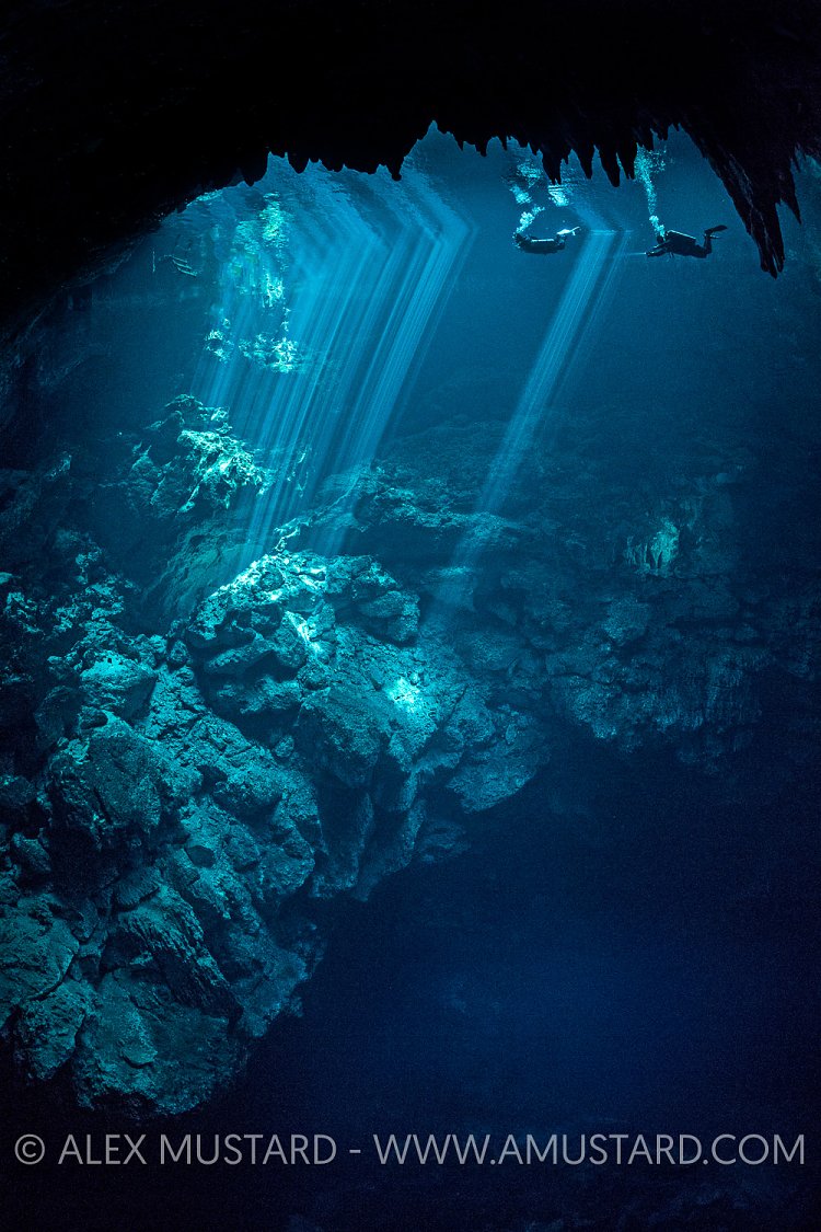Divers In The Pit. Mexico