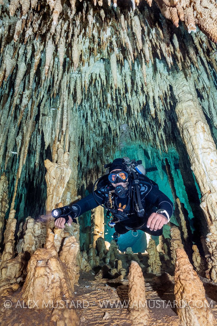 Diver Explores Cavern. Mexico
