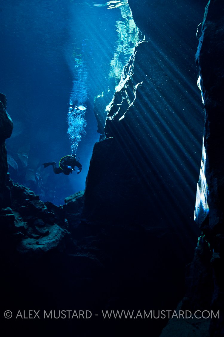 Diver in Nikulasargja Canyon. Iceland