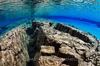 Divers In Blue Lagoon, Silfra, Iceland.
