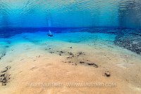 A diver in Blue Lagoon, Silfra. Iceland