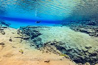 A diver in Blue Lagoon, Silfra. Iceland