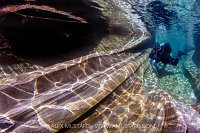 Diver In River Verzasca, Switzerland
