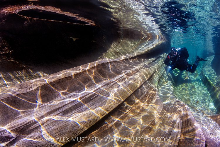 Diver In River Verzasca, Switzerland