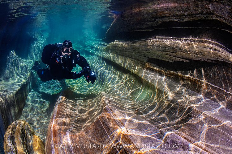 Diver In River Verzasca, Switzerland