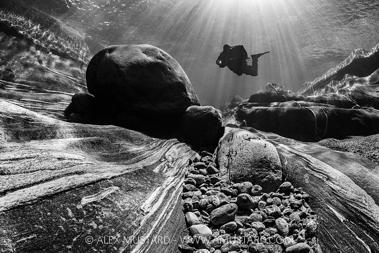 Diver In River Verzasca, Switzerland
