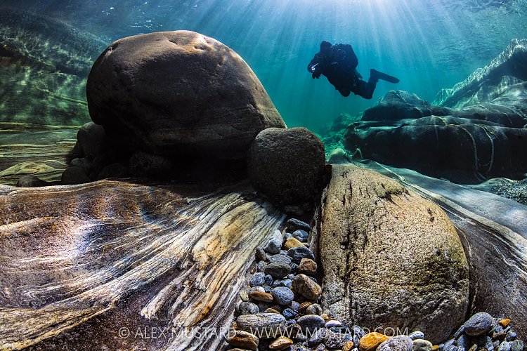 Diver In River Verzasca, Switzerland