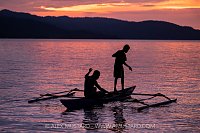 Fishermen In Dugout Canoe, Indonesia