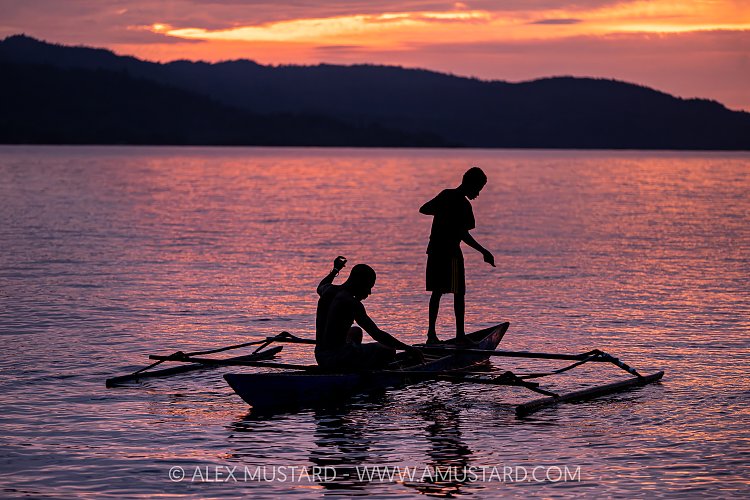 Fishermen In Dugout Canoe, Indonesia