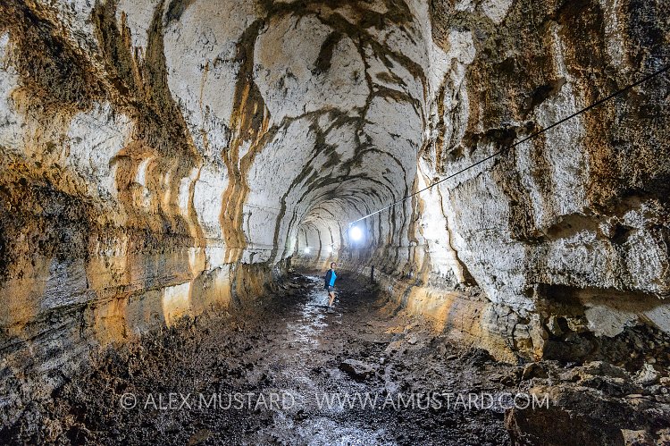Exploring A Lava Tunnel. Galapagos