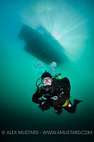 Diver Beneath Boat. Canada