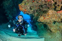 Underwater Photographer In Cavern. Cayman Islands