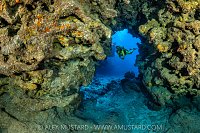 Diver Explores Caverns, Cayman Islands