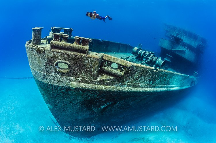 Snorkeller on scooter over Kittiwake. Cayman Islands