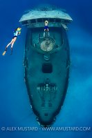 Snorkellers On Scooters On Kittiwake. Cayman Islands