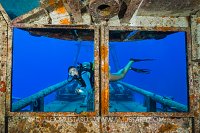 Diver Explores Kittiwake. Cayman Islands.