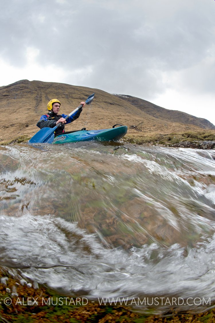 Canoeist In Highland River. UK.