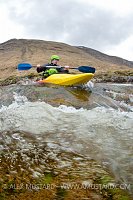 Canoeist In Highland River. UK.