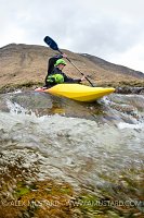 Canoeist In Highland River. UK.