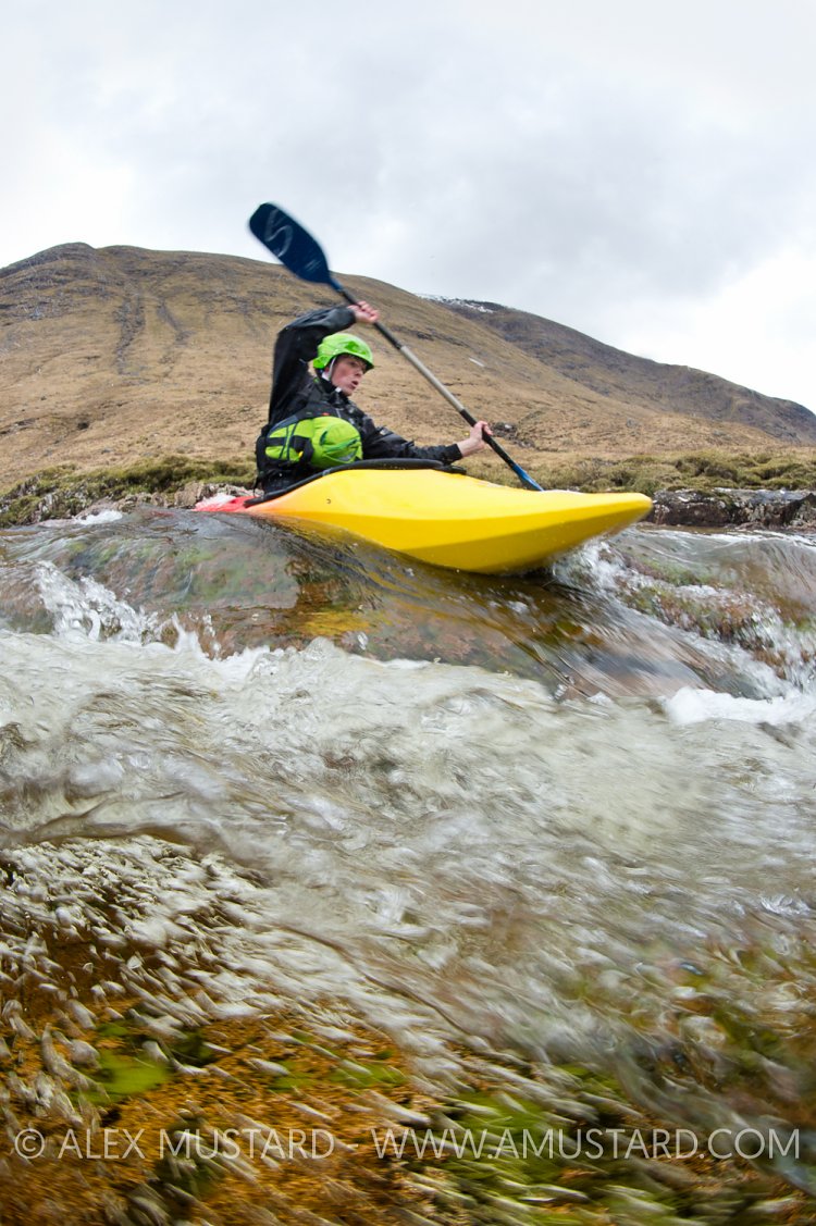 Canoeist In Highland River. UK.