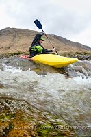 Canoeist In Highland River. UK.