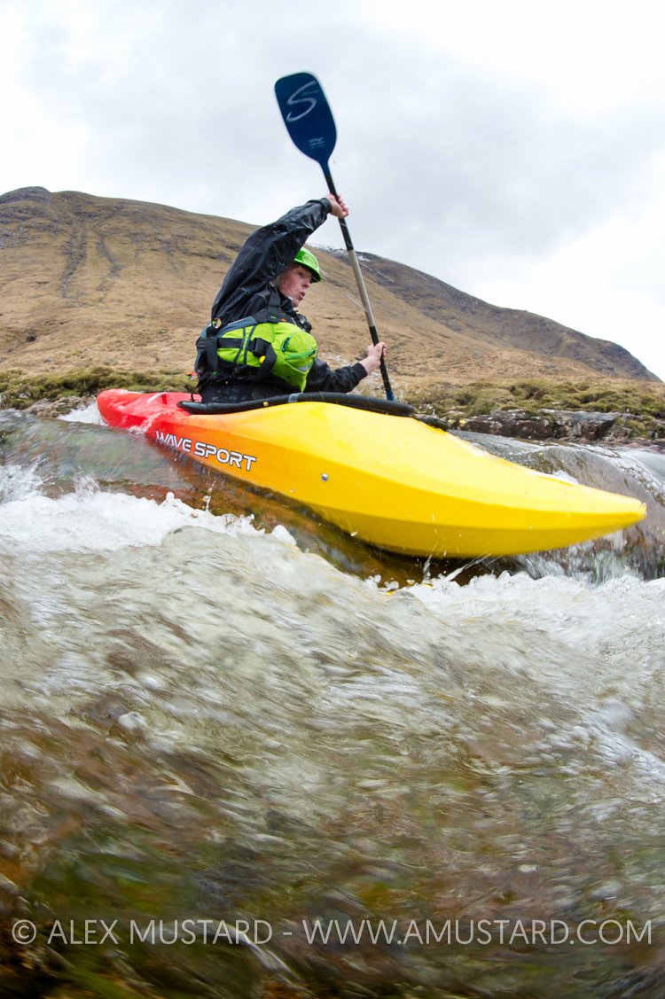 Canoeist In Highland River. UK.