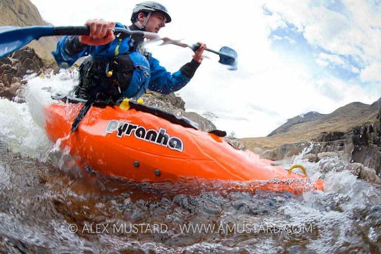 Canoeist In Highland River. UK.