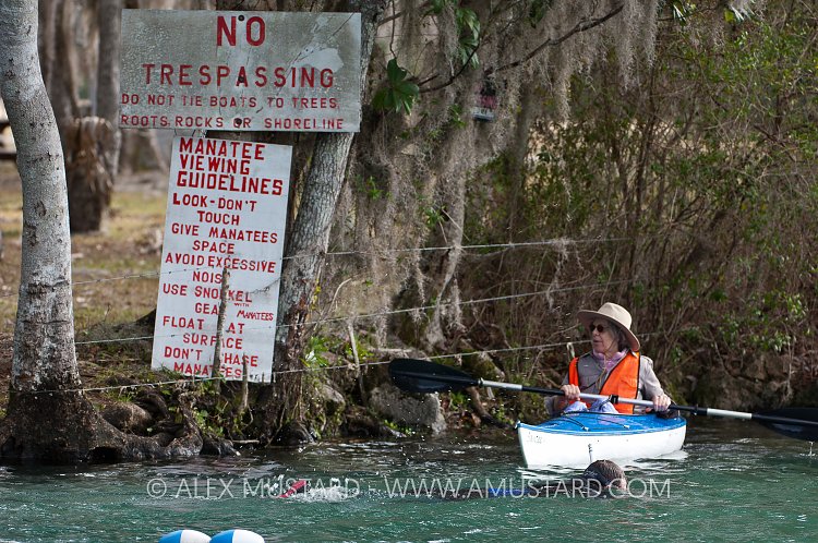 Warden patrols manatee waters. USA