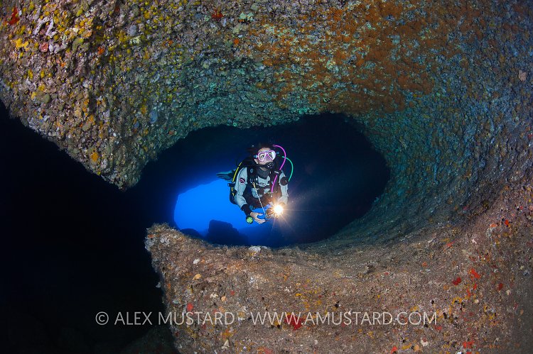 Diver In Cave. Sardinia, Italy