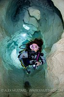 Diver Explores The Ghost Cave. Sardinia, Italy.