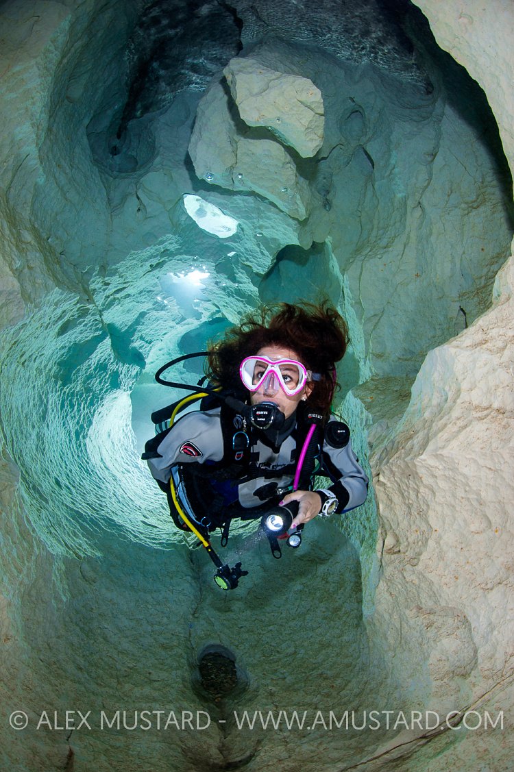 Diver Explores The Ghost Cave. Sardinia, Italy.