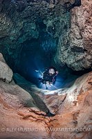 Diver In Stalactite Cave. Sardinia, Italy.