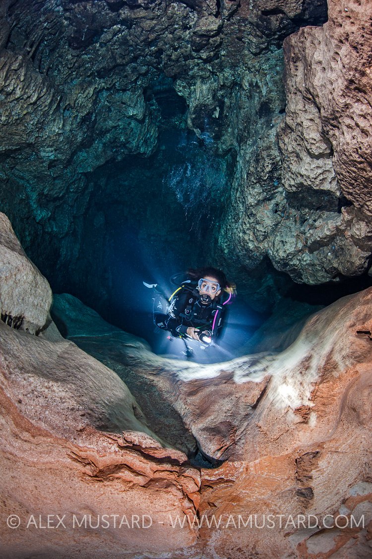 Diver In Stalactite Cave. Sardinia, Italy.