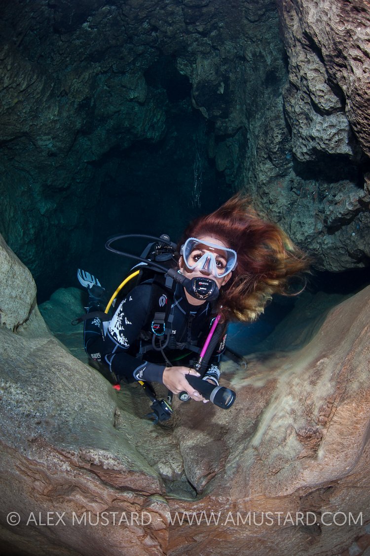 Diver In Stalactite Cave. Sardinia, Italy.