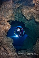 Diver in Cave. Sardinia, Italy