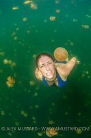 A girl (Heidi Cuddy) swims in jellyfish lake. Palau